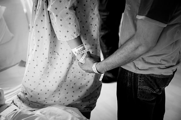 Husband supports wife after c-section.