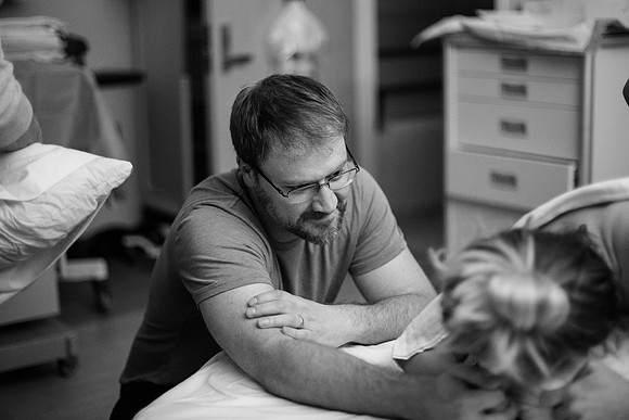 Husband helps wife through birth labor los angeles