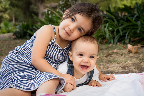 Sisters laughing in a park