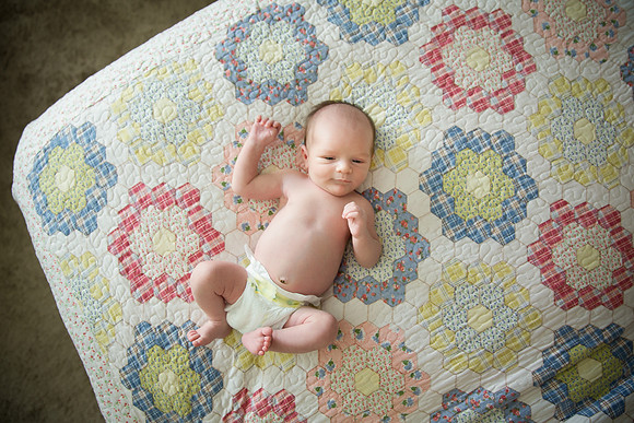 Happy baby boy in diaper.