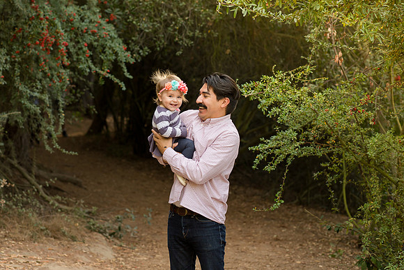Dad and one year old baby daughter laugh in Coldwater Canyon